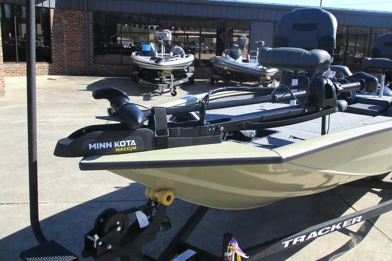 Slide: The Image of 2026 Tracker Pro Team 190 boat with Minn Kota Maxxum motor in showroom. - 8