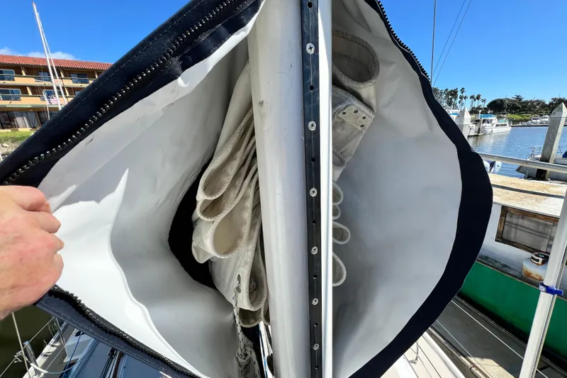 Slide: The Image of Sail storage on a 1987 Catalina 30 MkII yacht, docked at a marina. - 10