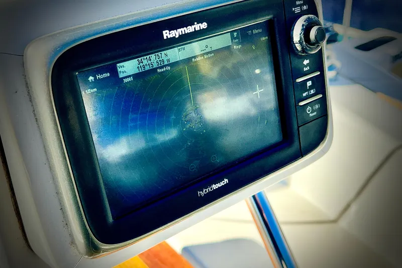 Slide: The Image of Raymarine navigation system on 1987 Catalina 30 MkII sailboat, displaying radar and coordinates. - 14