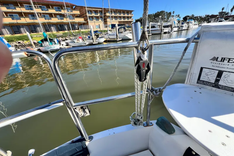 Slide: The Image of Catalina 30 MkII sailboat deck view with marina background, 1987 model. - 18