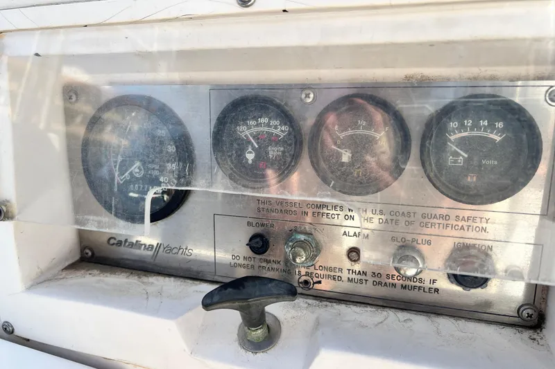 Slide: The Image of Control panel of a 1987 Catalina 30 MkII yacht with gauges and switches. - 20