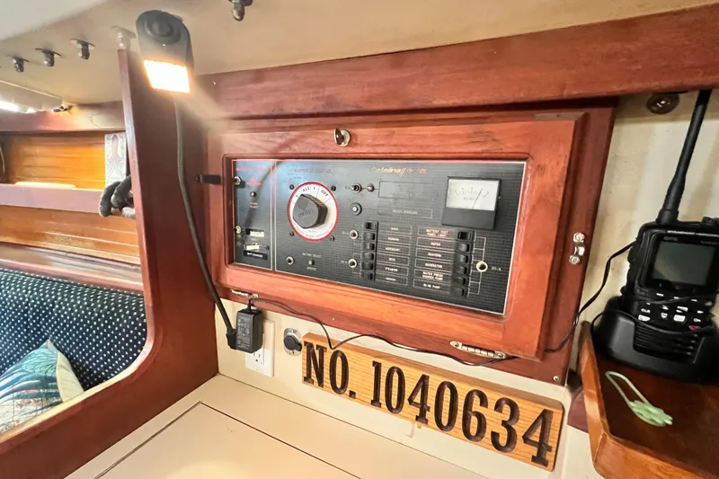Slide: The Image of Electrical panel inside 1987 Catalina 30 MkII sailboat cabin with radio and light. - 24