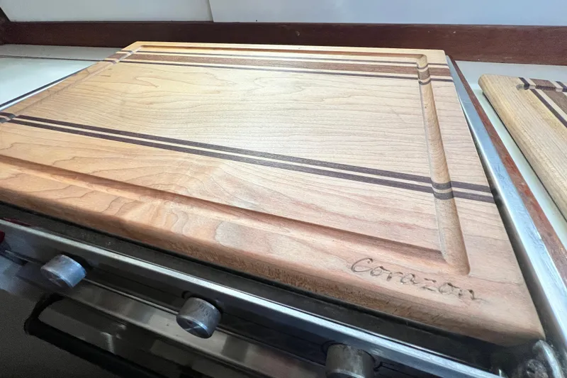 Slide: The Image of Wooden cutting board on a stove in a 1987 Catalina 30 MkII boat kitchen. - 27