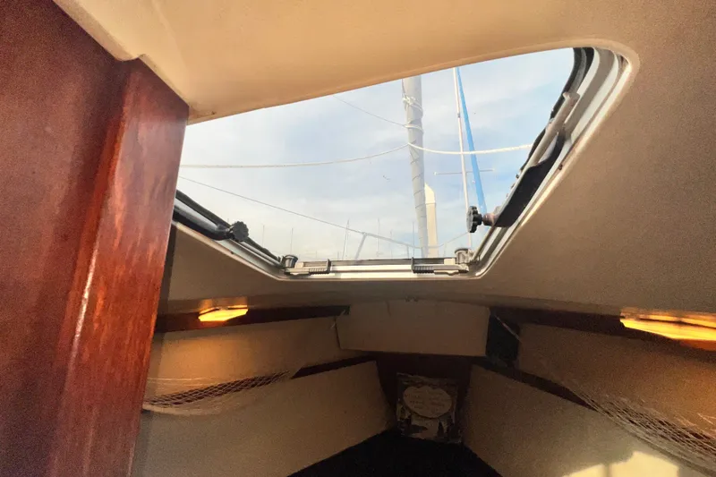 Slide: The Image of Interior view of 1987 Catalina 30 MkII sailboat cabin with open hatch. - 35