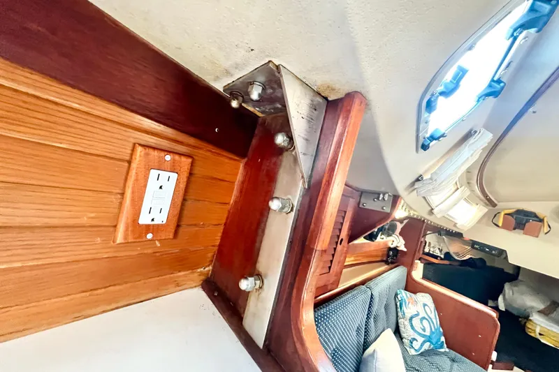 Slide: The Image of Interior of 1987 Catalina 30 MkII sailboat with wood paneling and electrical outlet. - 40