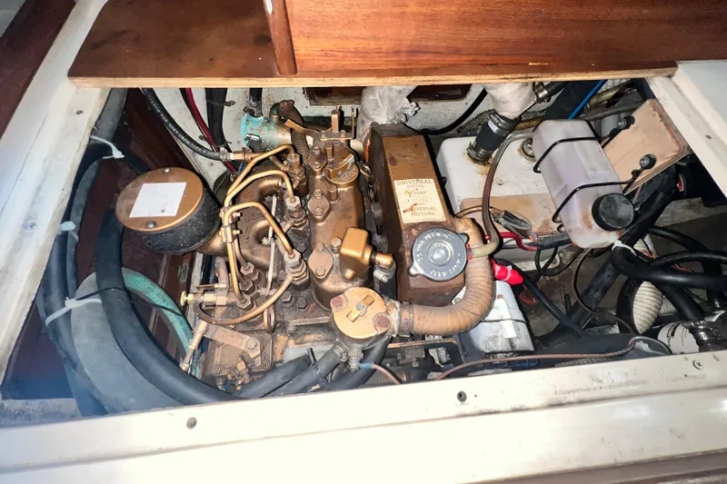 Slide: The Image of Engine compartment of a 1987 Catalina 30 MkII sailboat, showcasing mechanical components. - 42