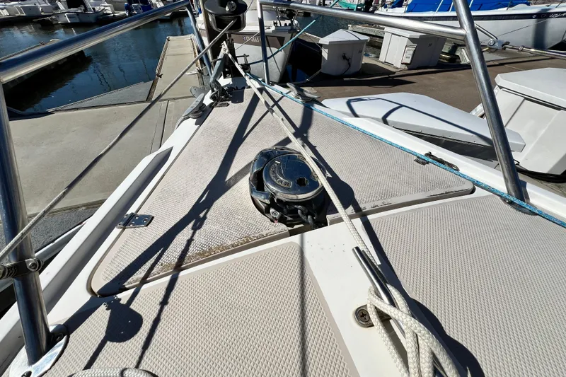Slide: The Image of Bow of 1987 Catalina 30 MkII sailboat with winch and ropes at marina. - 5