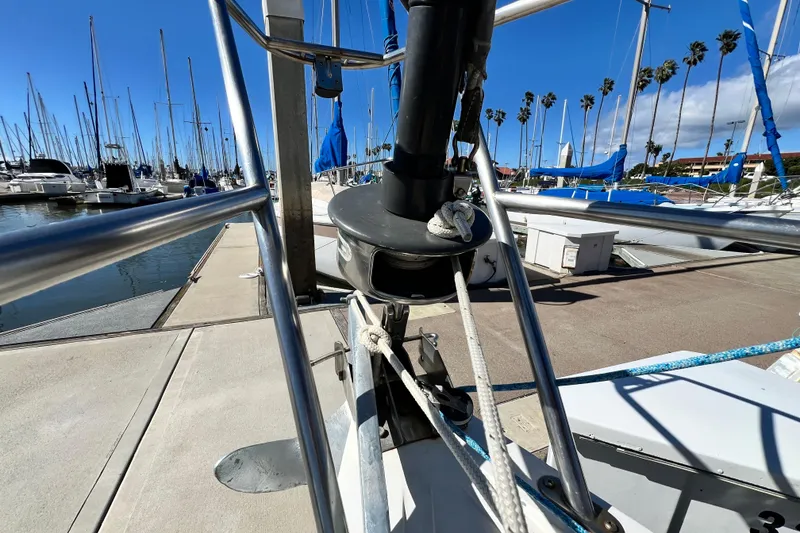 Slide: The Image of Catalina 30 MkII sailboat docked at marina, showcasing rigging and deck details, 1987 model. - 6