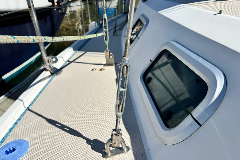 Slide: The Image of 1987 Catalina 30 MkII sailboat deck with rigging and windows in sunlight. - 7