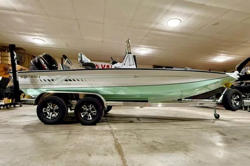 The Image of 2026 Express H20 Bay boat on trailer in indoor showroom. - 1