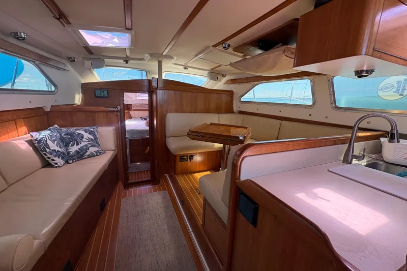 Slide: The Image of Catalina Morgan 440 sailboat docked at marina, 2007 model, under clear blue sky. - 12