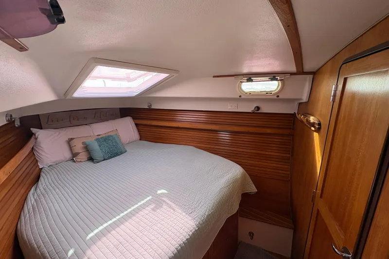 Slide: The Image of Catalina Morgan 440 sailboat, 2007 model, docked with covered boom and rigging. - 14