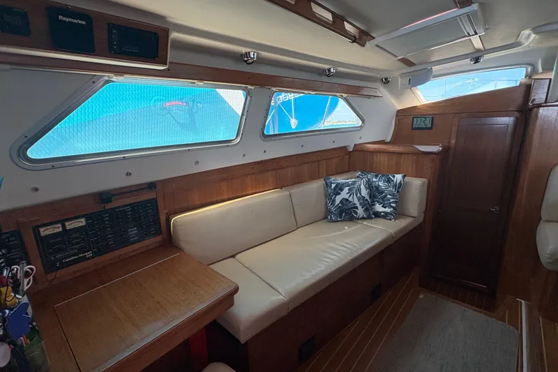 Slide: The Image of Interior view of 2007 Catalina Morgan 440 sailboat cockpit with ropes and cushions. - 17