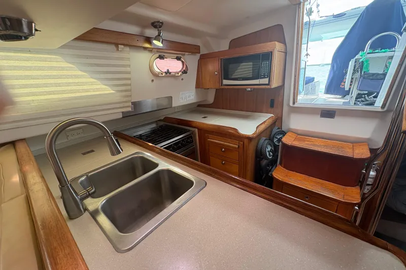 Slide: The Image of Sailing rope clutches on a 2007 Catalina Morgan 440 yacht, organized and labeled for easy access. - 20