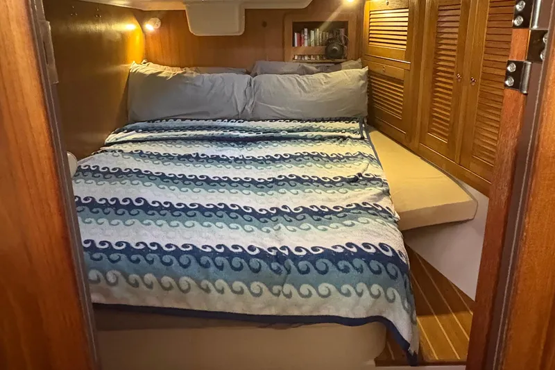 Slide: The Image of Cockpit of 2007 Catalina Morgan 440 sailboat docked at marina with dinghy overhead. - 22