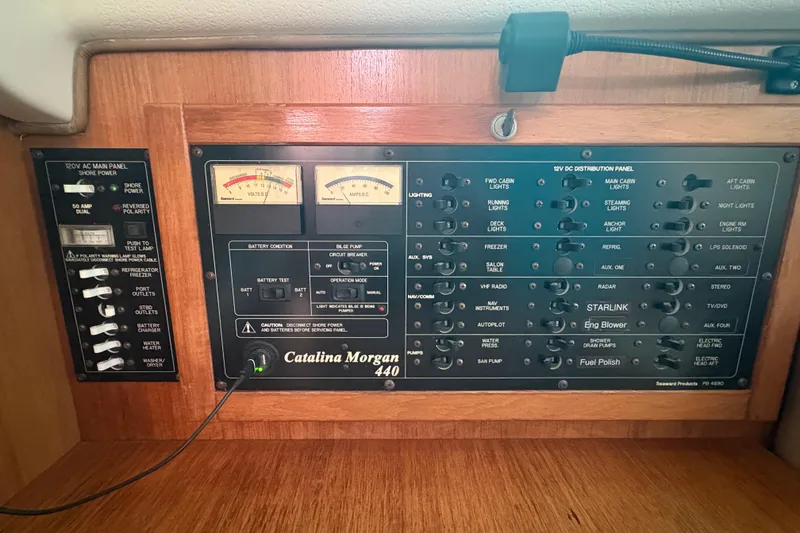 Slide: The Image of Cockpit of 2007 Catalina Morgan 440 sailboat with seating and nautical equipment. - 26