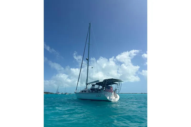 Slide: The Image of Sailboat Catalina Morgan 440, 2007 model, anchored in clear blue ocean under sunny sky. - 3