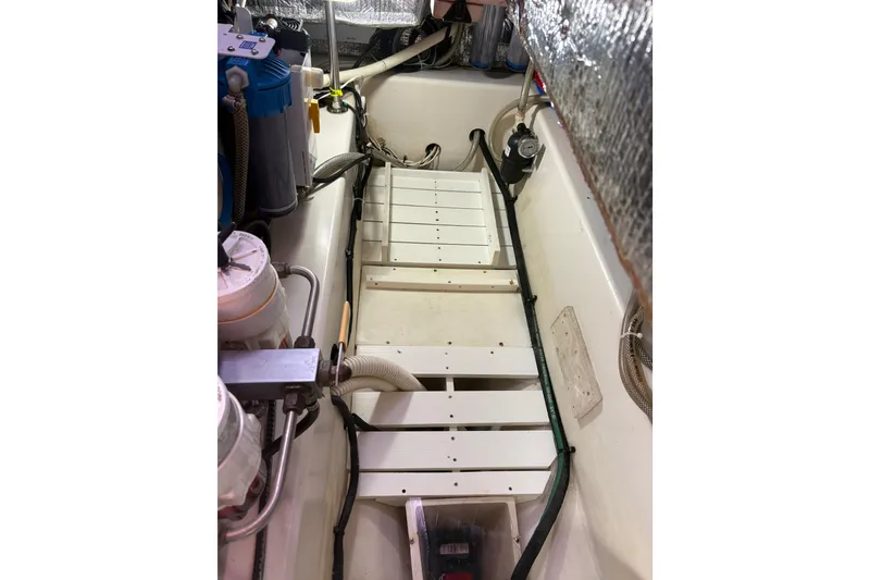 Slide: The Image of Cockpit controls of a 2007 Catalina Morgan 440 yacht with navigation instruments. - 32