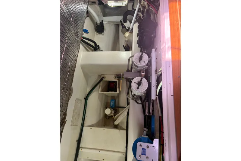 Slide: The Image of Cockpit controls of a 2007 Catalina Morgan 440 sailboat, featuring a throttle lever and navigation instruments. - 33