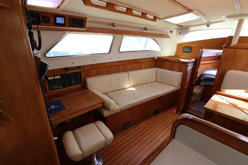 Slide: The Image of Interior of 2007 Catalina Morgan 440 yacht with wooden furnishings and beige seating. - 38