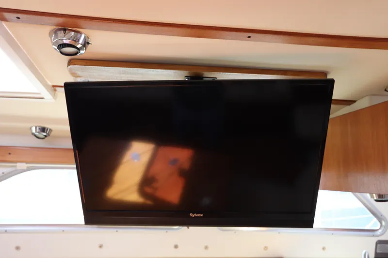 Slide: The Image of Flat-screen TV mounted inside 2007 Catalina Morgan 440 yacht cabin. - 41