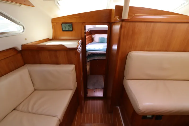 Slide: The Image of Interior of 2007 Catalina Morgan 440 yacht with wood finish and beige seating. - 43