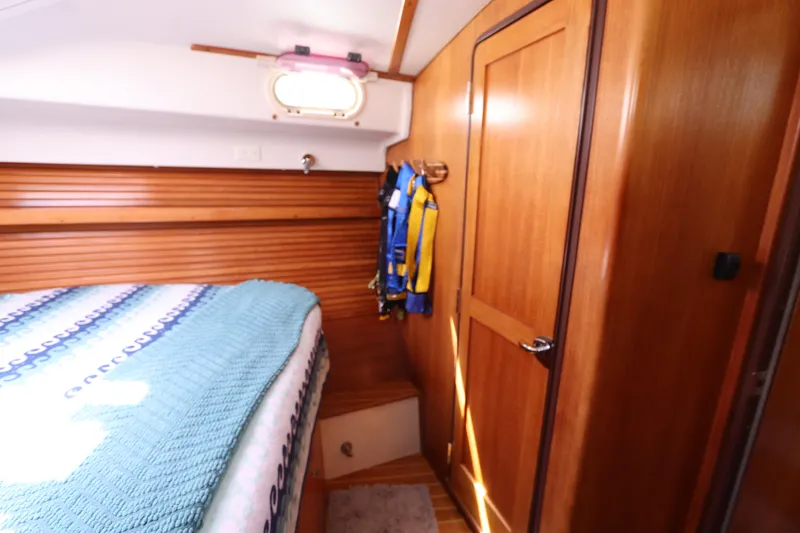Slide: The Image of Cozy cabin interior of 2007 Catalina Morgan 440 sailboat with wooden finishes. - 46