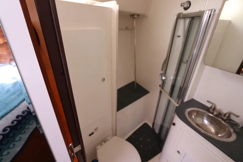 Slide: The Image of Bathroom interior of 2007 Catalina Morgan 440 yacht, featuring shower and sink. - 48