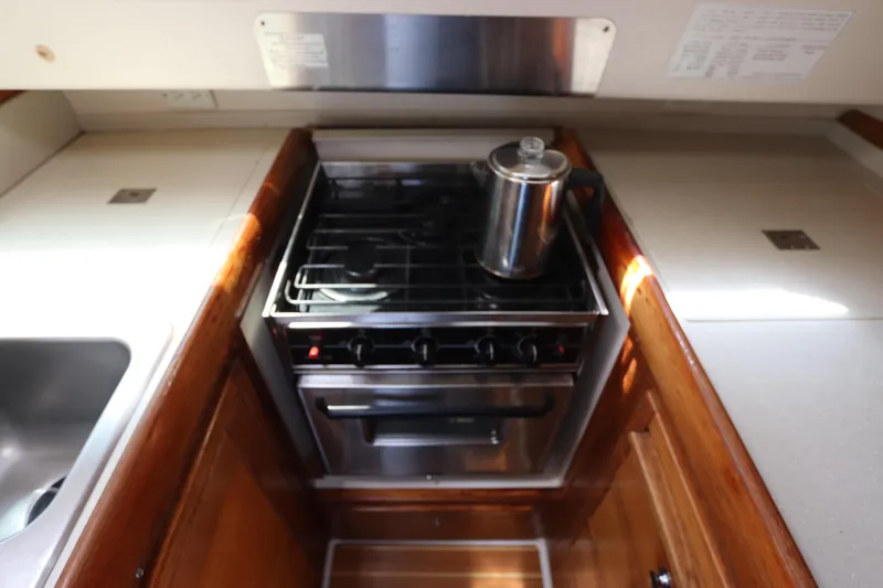 Slide: The Image of Galley kitchen in 2007 Catalina Morgan 440 yacht with stove and kettle. - 56