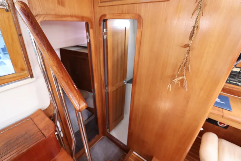Slide: The Image of Interior of 2007 Catalina Morgan 440 yacht with wooden stairs and door. - 61
