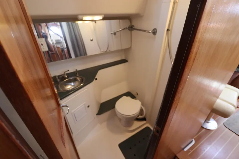 Slide: The Image of Compact bathroom in a 2007 Catalina Morgan 440 yacht, featuring a sink and toilet. - 62