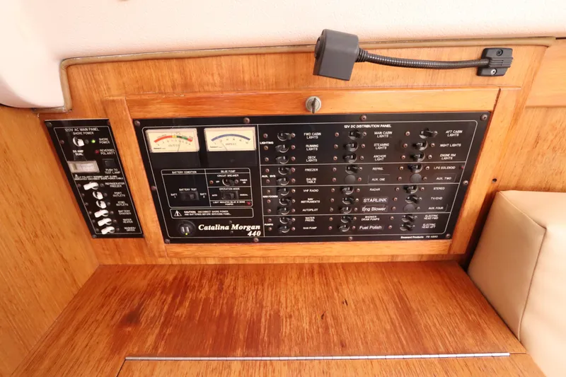 Slide: The Image of Control panel of a 2007 Catalina Morgan 440 yacht, featuring various switches and gauges. - 70