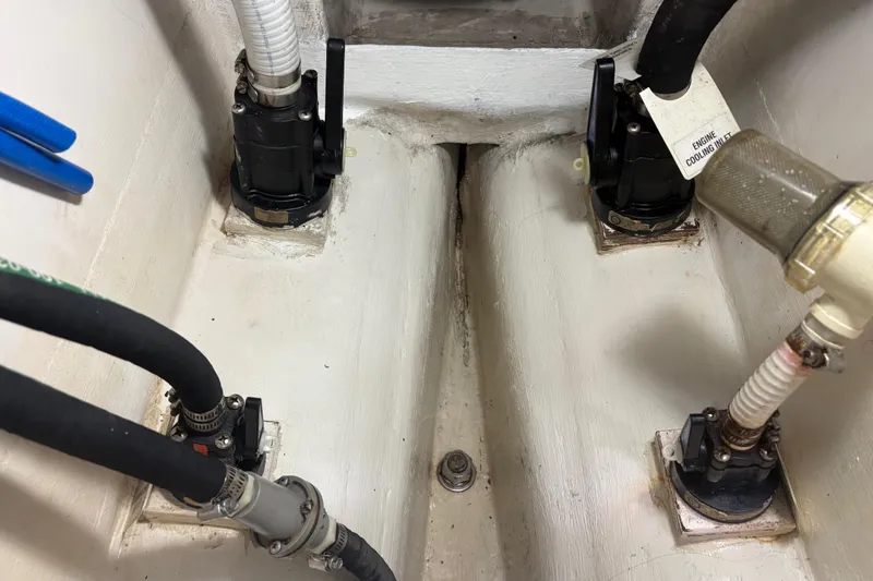 Slide: The Image of Engine compartment of a 2007 Catalina Morgan 440 with hoses and valves. - 75