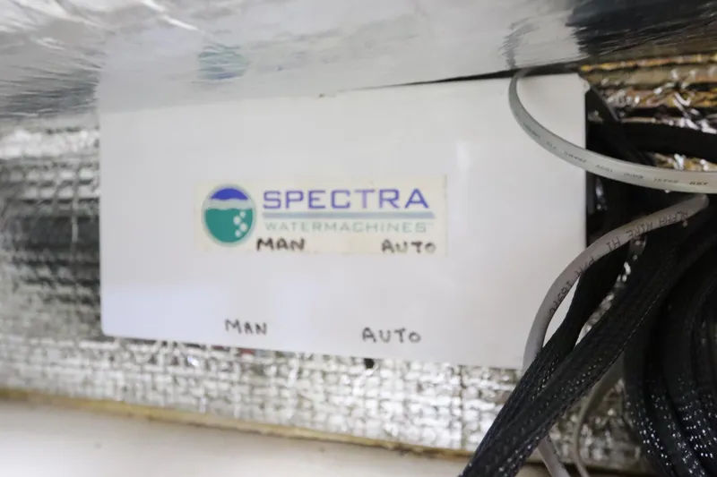 Slide: The Image of Spectra Watermachines control panel on 2007 Catalina Morgan 440 yacht. - 77