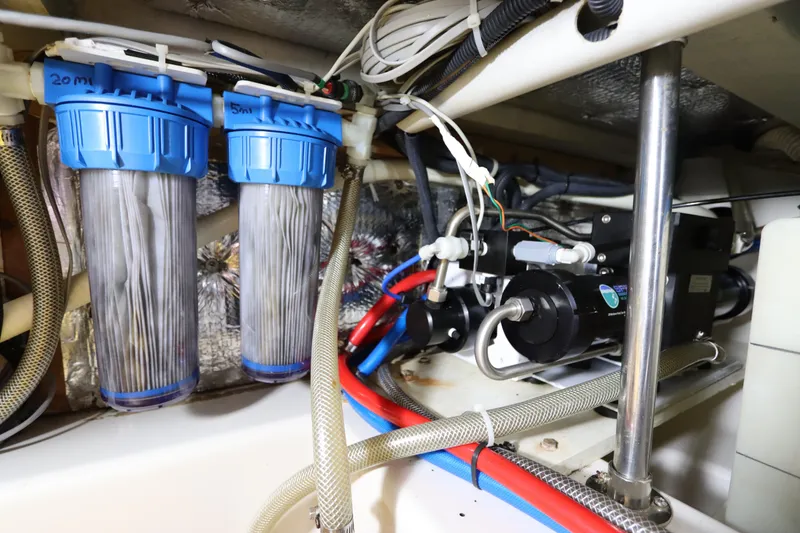Slide: The Image of Engine room of 2007 Catalina Morgan 440 with water filtration system and wiring. - 79