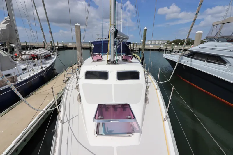 Slide: The Image of Catalina Morgan 440 sailboat with Tohatsu outboard motor, docked in a marina, 2007 model. - 8