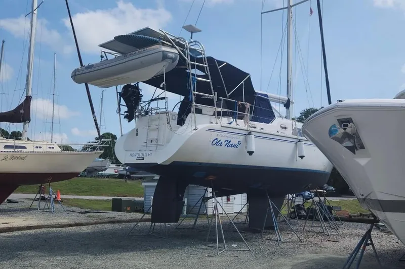 Slide: The Image of Catalina Morgan 440 sailboat, 2007 model, on dry dock with other boats. - 87
