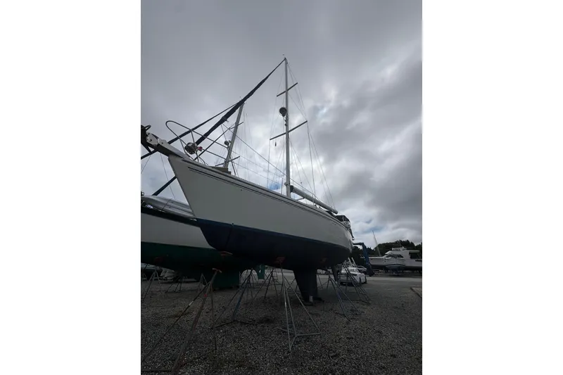 Slide: The Image of Catalina Morgan 440 sailboat, 2007 model, on dry dock under cloudy skies. - 88