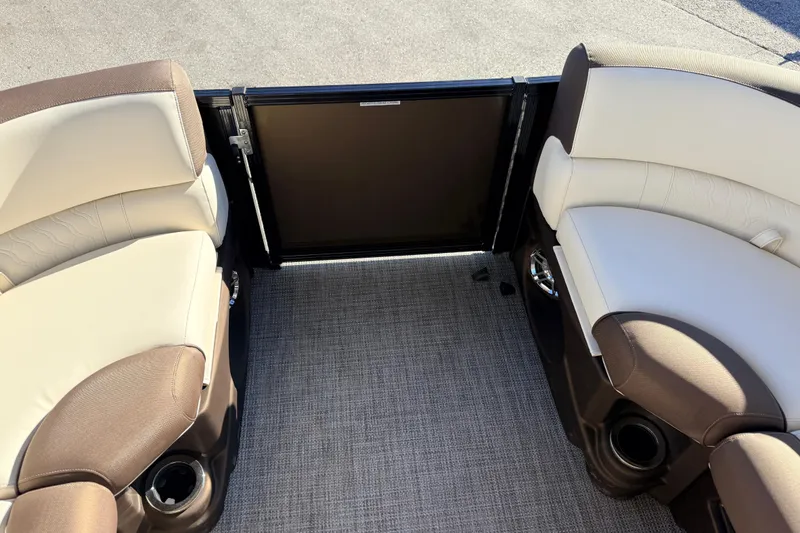 Slide: The Image of 2026 Avalon 2385 LSZ Quad Lounger interior with plush seating and cup holders. - 14