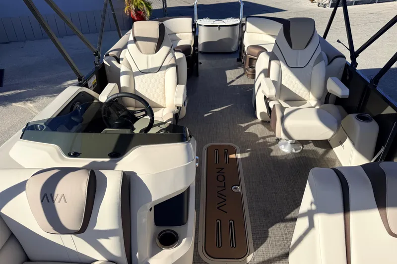 Slide: The Image of 2026 Avalon 2385 LSZ Quad Lounger Tri Toon interior with luxurious seating and helm. - 15