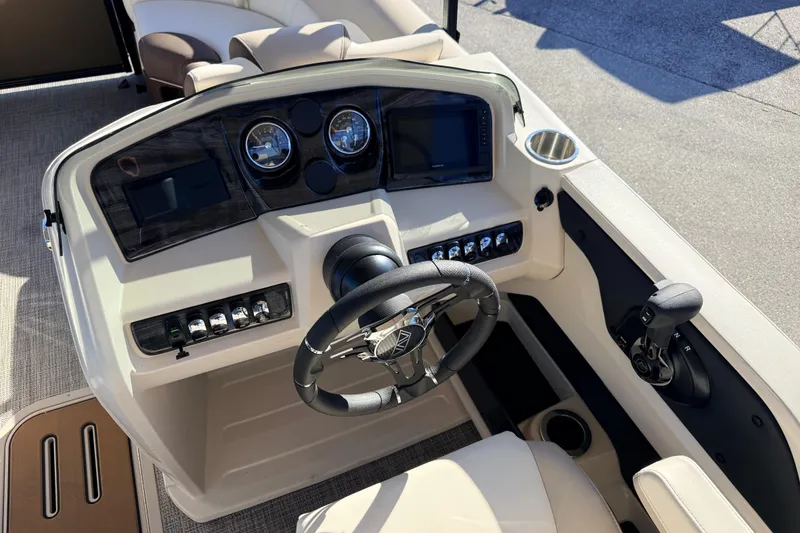 Slide: The Image of 2026 Avalon 2385 LSZ Quad Lounger helm with modern controls and steering wheel. - 21