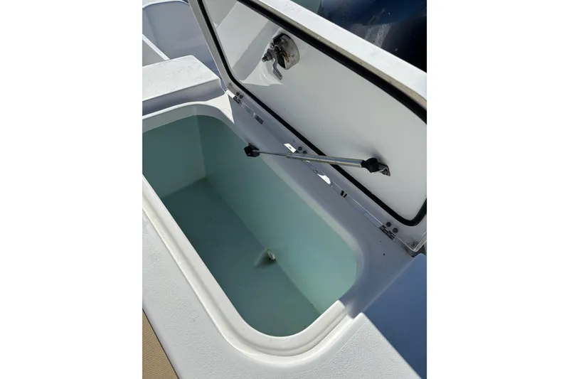 Slide: The Image of Open storage compartment on a 2018 Sea Hunt Gamefish 25 boat. - 18