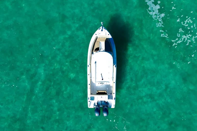 Slide: The Image of Overhead view of 2018 Sea Hunt Gamefish 25 boat on clear turquoise water. - 4