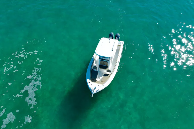 Slide: The Image of Aerial view of 2018 Sea Hunt Gamefish 25 boat on clear turquoise water. - 5