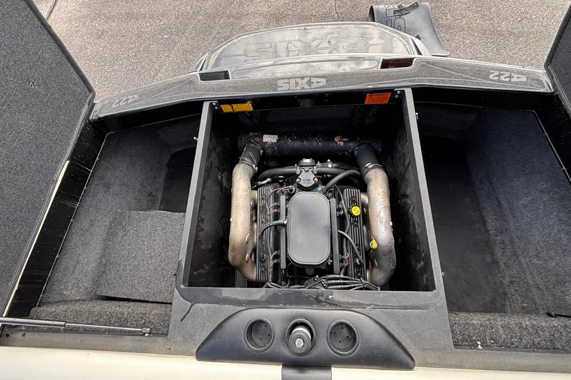 Slide: The Image of 2012 Axis A22 boat engine compartment with visible engine components. - 16