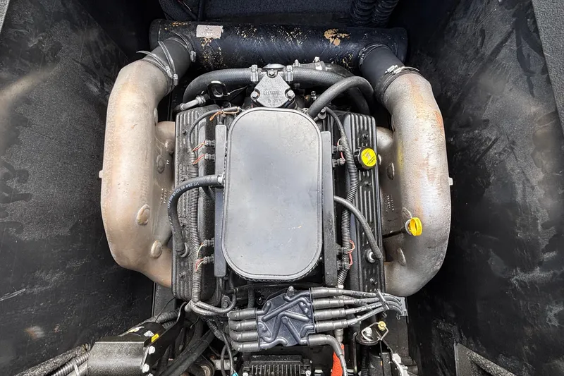 Slide: The Image of 2012 Axis A22 engine compartment with visible components and wiring. - 17