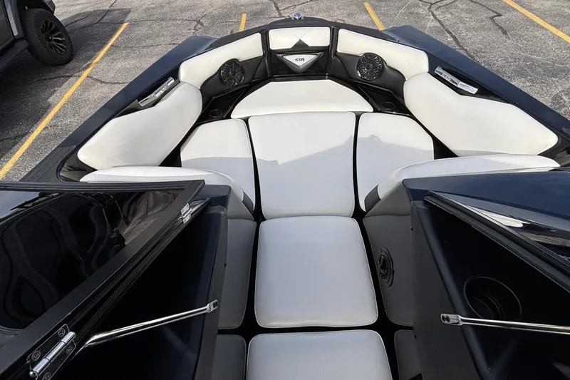 Slide: The Image of Interior view of 2012 Axis A22 boat with white cushioned seating. - 23