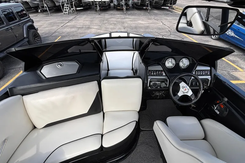 Slide: The Image of Interior of a 2012 Axis A22 boat with modern dashboard and seating. - 31
