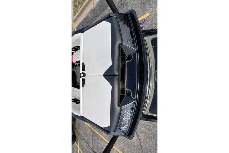 Slide: The Image of 2012 Axis A22 boat interior, featuring sleek black and white seating design. - 4