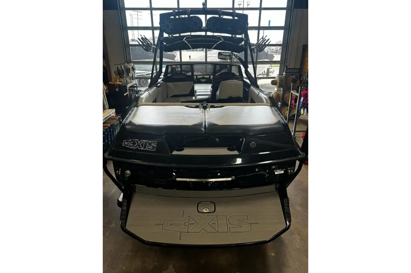 Slide: The Image of 2012 Axis A22 boat in a garage, showcasing sleek design and spacious interior. - 46